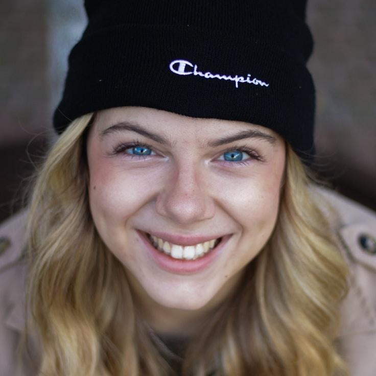 Kaveri Mehta, Lead Design Curator at Diversified Capital Bond, reviewing corporate floral arrangements